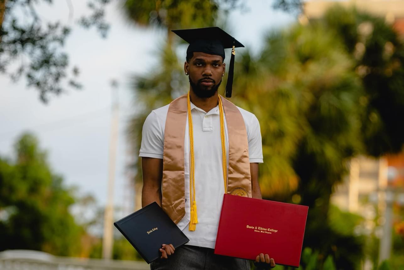 Graduate with diplomas